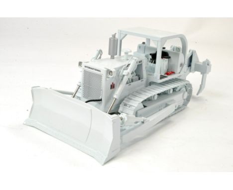 First Gear 1/24 issue comprising International TD25 Crawler Tractor with ROPS, Dozer Blade and Ripper. Appears generally exce