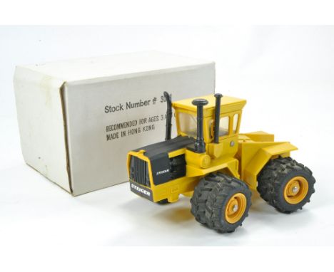 Ertl 1/32 Farm issue comprising Steiger Industrial Tractor. Plastic Version. Excellent with original box. 