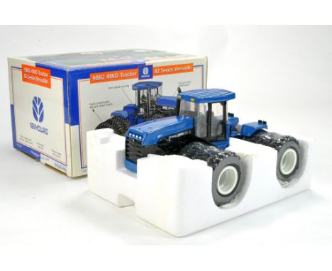 Ertl 1/32 New Holland Versatile 9882 Tractor with Triple Wheels. Excellent, not removed from box. 
