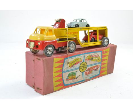 Wells Brimtoy Tinplate issue comprising No. 709 Car Transporter including winch and two cars. All generally with age related 
