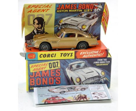 Corgi No. 261 James Bond 007 Aston Martin DB5. Gold with red interior, inc figures. Generally good, more signs of rubs and ma