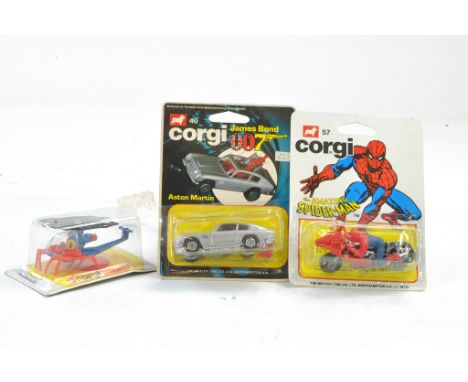 Corgi Trio comprising carded James Bond Aston Martin, Spiderman Spider Bike and Spider Copter. Generally excellent, cards sea