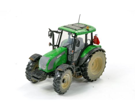 Universal Hobbies 1/32 Code 3 - Weathered and Modified issue comprising Valtra C Tractor in Lime Green. Appears very good to 