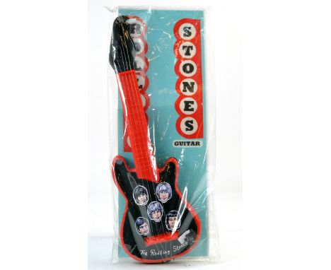 Rolling Stones Plastic Guitar with header card and packing bag. 