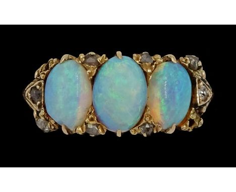 Early 20th century 15ct gold three stone opal ring, with diamond accents set betweenCondition Report:Approx 5.3gm, tested 15c