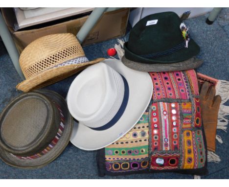 A small table top carpet, various gentleman's hats, and an Eastern inspired cushion. (a quantity)