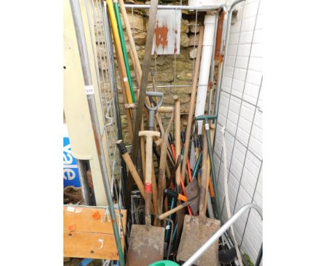 A group of garden tools, spades, rakes, garden edger, hose, etc. (a large quantity - contents of one cage)