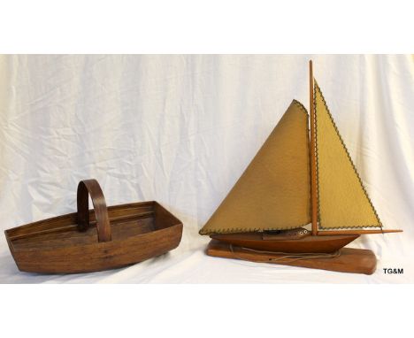 A boat shaped trug basket and a boat shaped table lamp