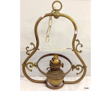 A hanging brass oil lamp converted to 240v