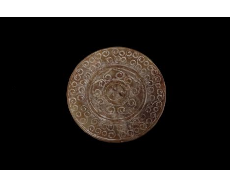 Chinese Art A jade Pi disc with millet grain decoration China, Han Period, 200 b.C. - 200 AD. . Cm 8,50.