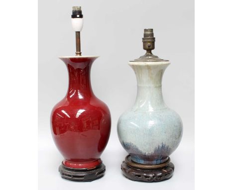 A Chinese Porcelain Baluster Vase, Qianlong style, in sang de boeuf glaze and mounted as a table lamp, together with similar 