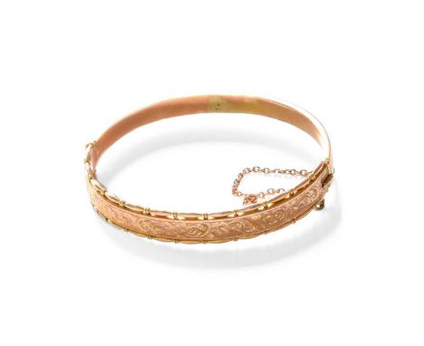 A 9 Carat Gold Hinged Bangle, inner measurements 6.0cm by 5.1cm  Gross weight 10.9 grams.