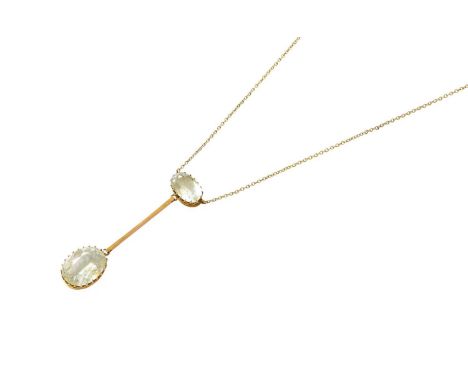An Aquamarine Necklace, an oval cut aquamarine suspends a larger oval cut aquamarine by a plain polished bar, in yellow claw 