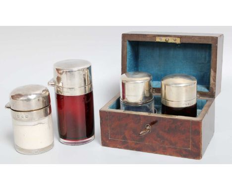Four Various Silver-Mounted Glass Scent-Bottles, each cylindrical, two with ruby glass bodies and two with clear glass bodies