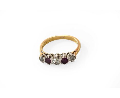 An 18 Carat Gold Ruby and Diamond Five Stone Ring, three graduated old cut diamonds alternate with round cut rubies, in white