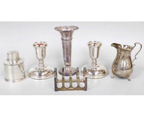 A Collection of Assorted Silver, including a tea-caddy; a cream-jug; a toastrack; and pair of candlesticks, filled and a tape