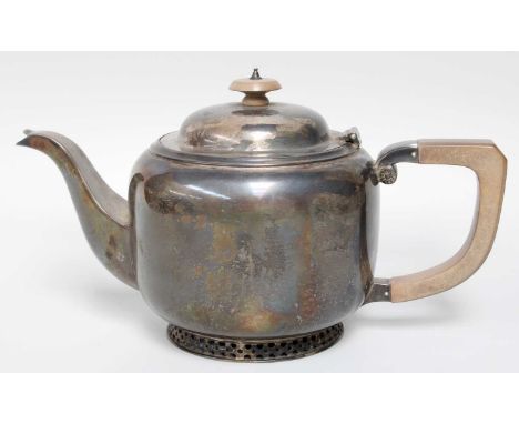 An Edward VIII Silver Teapot, by Thomas Bradbury and Sons Ltd., Sheffield, 1936, circular and on openwork foot, with wood han