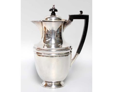 A George V Silver Hot-Water Jug, by James Henry and Herbert Barraclough, Sheffield, 1910, tapering and on spreading foot, wit