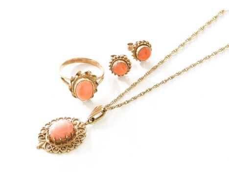A 9 Carat Gold Coral Pendant on Chain, the oval coral cabochon in yellow claw and filigree setting, on fancy link chain, pend