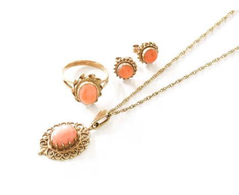 A 9 Carat Gold Coral Pendant on Chain, the oval coral cabochon in yellow claw and filigree setting, on fancy link chain, pend