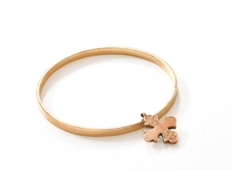 A Bangle, stamped ‘10CT’, inner diameter 6.7cm; and A Cross Pendant, unmarked, length 2.4cmBangle - 7.3 grams. Pendant – 1.9 