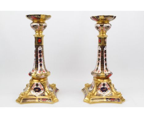 Pair of Royal Crown Derby 1128 pattern Castleton candlestick XXXIX, Out swept square base with dolphins to angles, 26.5cm to 