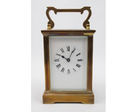 Good Quality 20thC Brass Cased carriage clock with roman numeral dial with double ended key 15cm in Height with double ended 