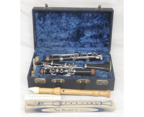 Cased Corton clarinet and a Schotts RecorderShipping £38.00 plus vat (UK Only)