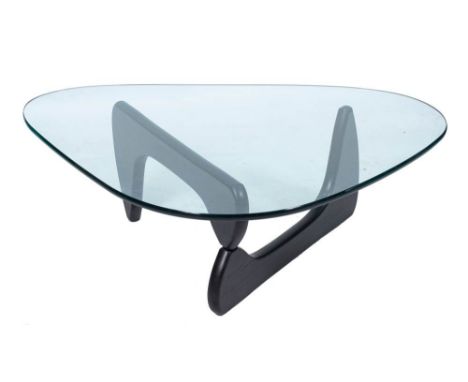 After Isamu Noguchi [1904-1988], a model IN-50 coffee table,:- the shaped glass top etched with signature and 'Vitra Design M