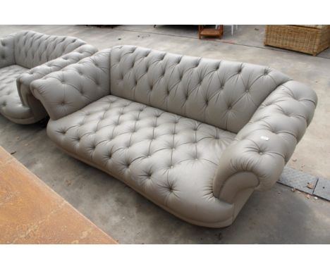 A LEATHER CHESTERFIELD STYLE BUTTON BACK THREE-SEATER SETTEE ON TURNED LEGS 