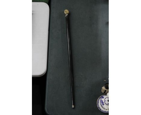 A BRASS FOUR FACED BUDDHA HANDLE WALKING STICK 