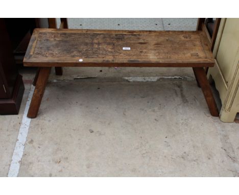 AN OAK PIG BENCH STYLE COFFEE TABLE 37" X 12" 