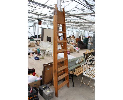 A VINTAGE SEVEN RUNG WOODEN STEP LADDER 