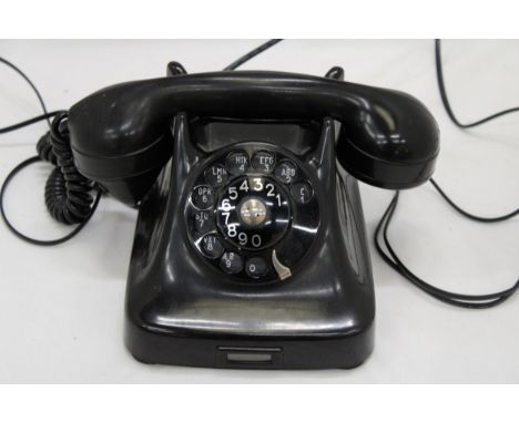 A VERY HEAVY VINTAGE TERRESTIAL TELEPHONE 