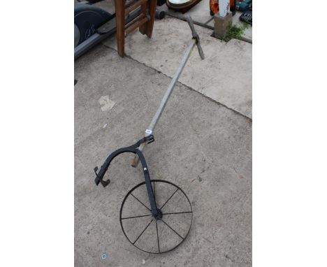 A VINTAGE WOODEN TILLER 