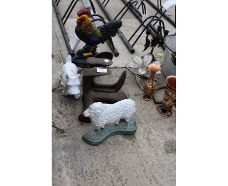 THREE CAST IRON ANIMAL DOORSTOPS AND TWO VINTAGE COBBLERS LASTS 