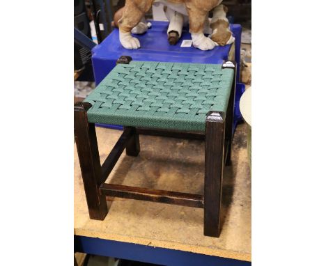 A VINTAGE FOOTSTOOL WITH GREEN WOVEN TOP 