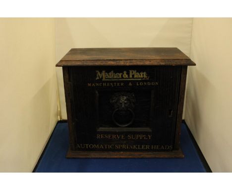 A VINTAGE MATHER AND PLATT MANCHESTER AND LONDON STORAGE BOX FOR RESERVE SUPPLY OF AUTOMATIC SPRINKLER HEADS WITH LION HEAD K