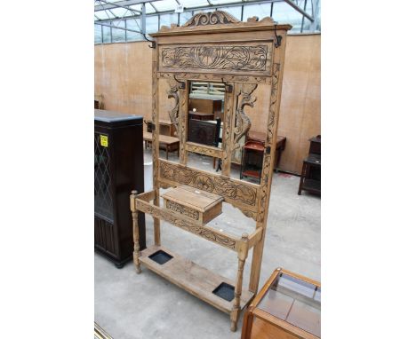 A LATE VICTORIAN CARED OAK MIRRORED HALL COAT/STICK STAND 