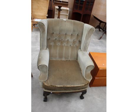 A GEORGION STYLE WINGED BUTTON-BACK EASY CHAIR ON FRONT CABRIOLE LEGS WITH CARVED KNEES ON BALL AND CLAW FEET 