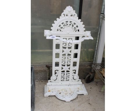 AN ANTIQUE CAST IRON STICK STAND WITH DRIP TRAY 