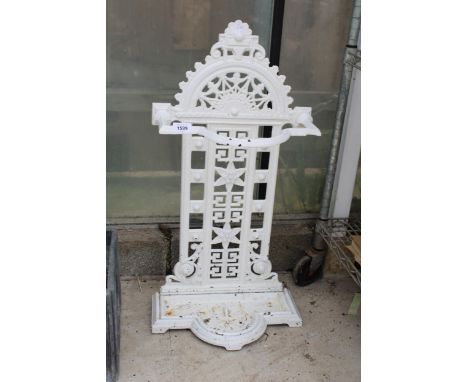 AN ANTIQUE CAST IRON STICK STAND WITH DRIP TRAY 