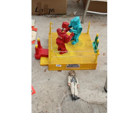 A RAVING BONKERS FIGHTING ROBOT TOY AND A FURTHER FIGURE 