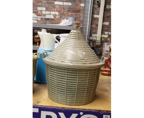A VINTAGE FIVE GALLON DEMIJOHN AND BASKET 