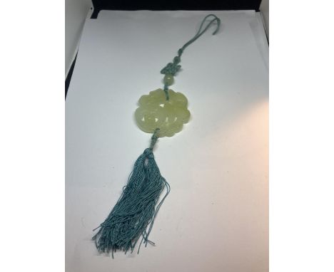 A JADE CARVED PENDANT 