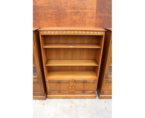 AN ERCOL BLONDE THREE TIER OPEN BOOKCASE WITH CUPBOARD TO BASE 39.5" WIDE 