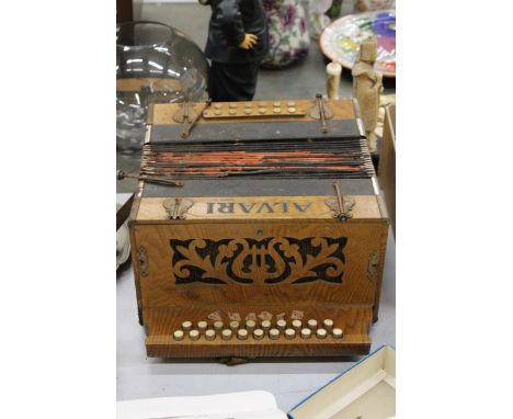 A VINTAGE ALVARI BUTTON ACCORDIAN 