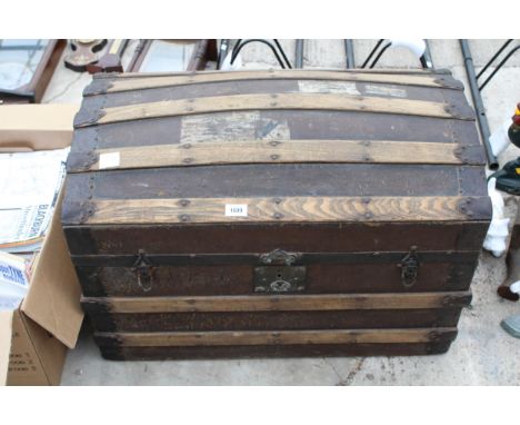 A VINTAGE WOODEN BANDED DOME TOPPED TRUNK 
