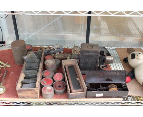 AN ASSORTMENT OF VINTAGE PHOTOGRAPHY EQUIPMENT TO INCLUDE A PROJECTOR, FILM REELS AND SLIDES ETC 