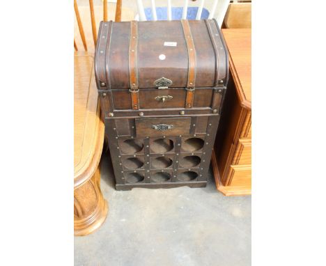 A MODERN PINE NINE BOTTLE WINE RACK IN THE FORM OF A TRUNK 